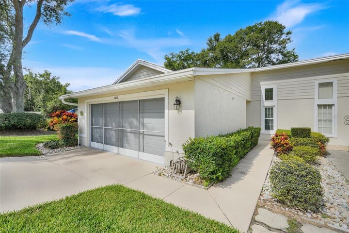 Property Photo:  8737 Village Green Boulevard  FL 34711 