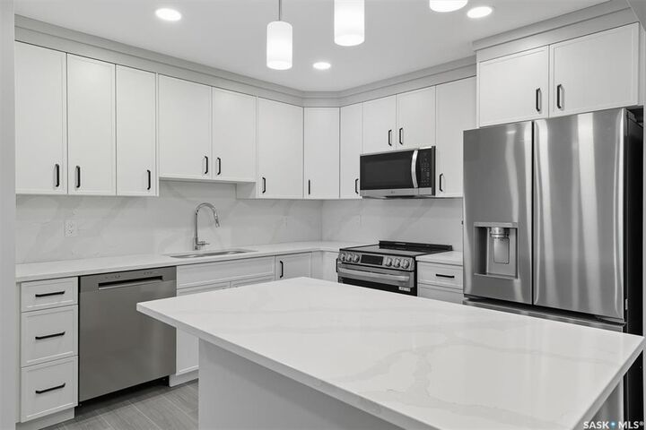 Property Photo: 318 108th Street W 208 SK S7N 1P8