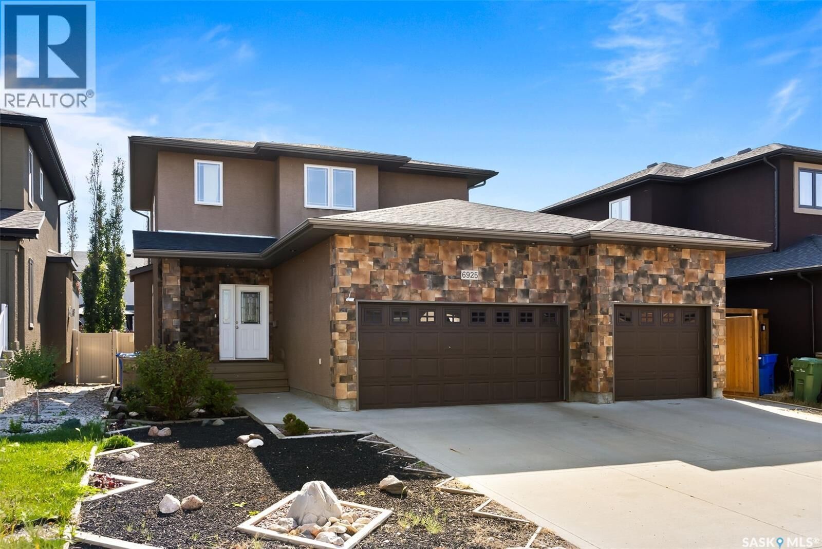 Property Photo: 6925 Maple Ridge Drive SK S4X 4J2