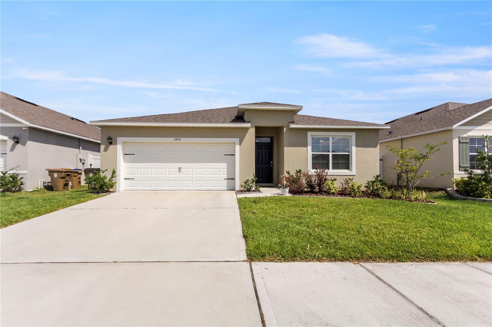 Property Photo: 1975 Cacutta Way FL 34744