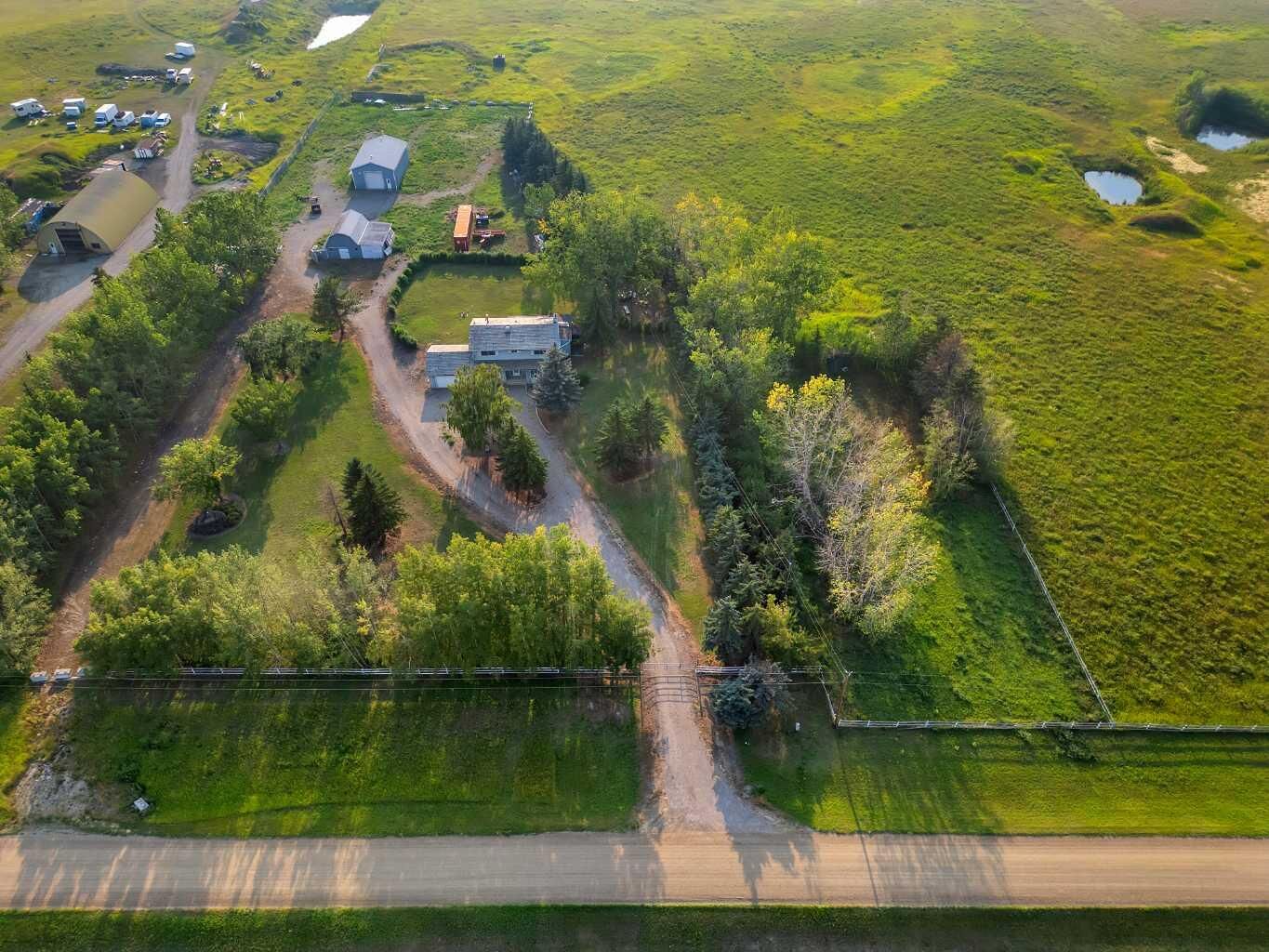 Property Photo: 233081 Glenmore View Road AB T1X 0H3