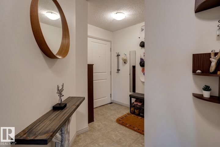 Property Photo: 11449 Ellerslie Road SW 218 AB T6W 1T2