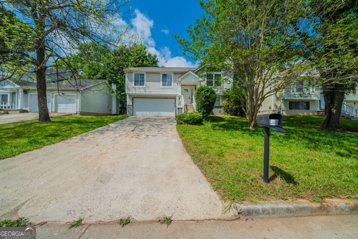 Property Photo:  6082 Raintree Bend  GA 30058 