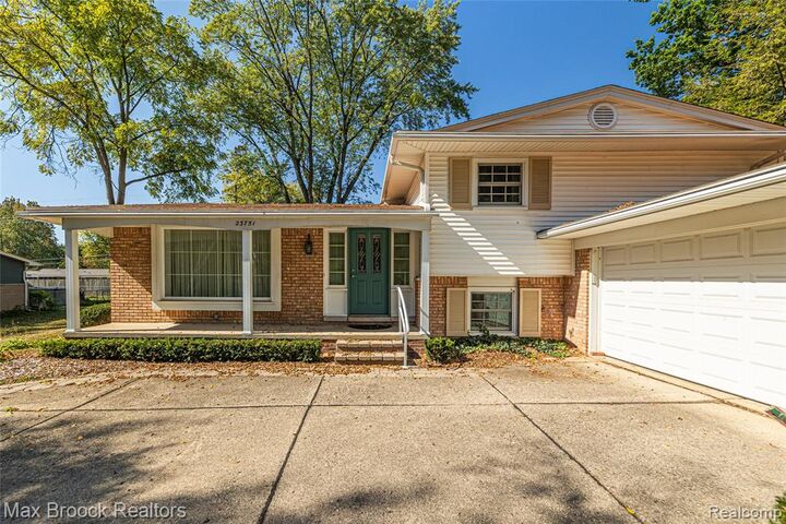 Property Photo:  23751 Gill Road  MI 48335 3515 