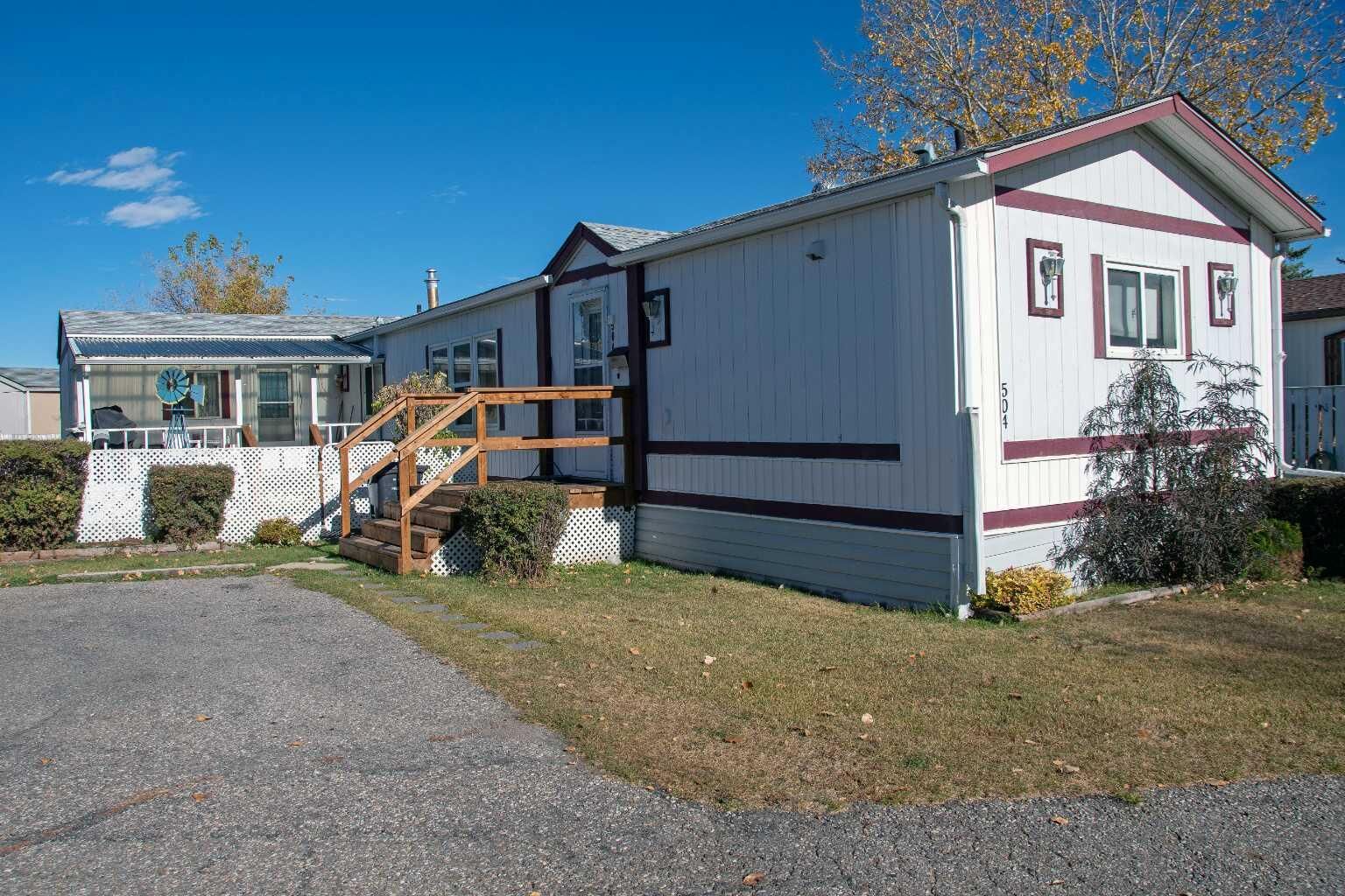 Property Photo:  504 Home Place SE  AB T1V 1K1
