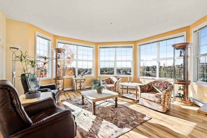 Property Photo:  1 Crystal Green Lane 300  AB T1S 0C5 