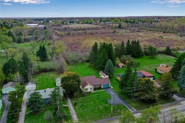 Property Photo:  8976 Wehrle Drive  NY 14031 