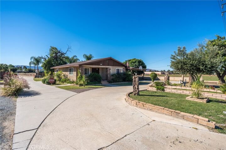 Property Photo:  831 W Lugonia  CA 92374 