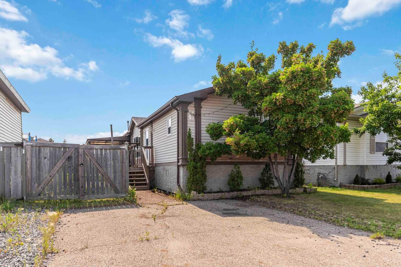 Property Photo: 305 Ash Way AB T9K 0G3