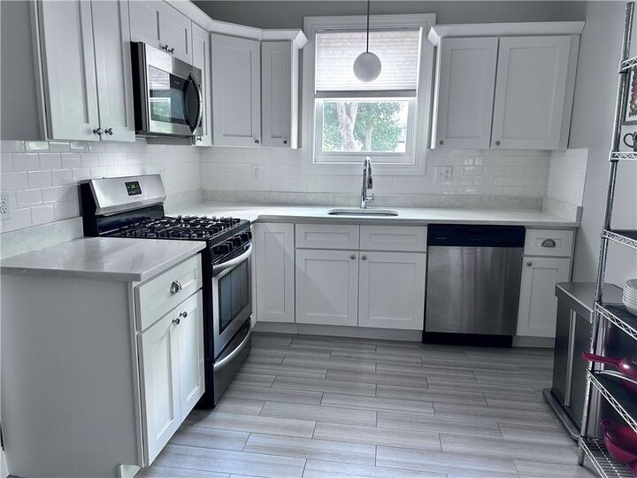 Property Photo:  141 Doyle Avenue 1  RI 02906