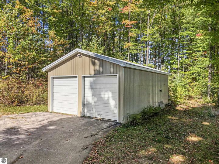 Property Photo:  185 N Three Mile Road  MI 49696 