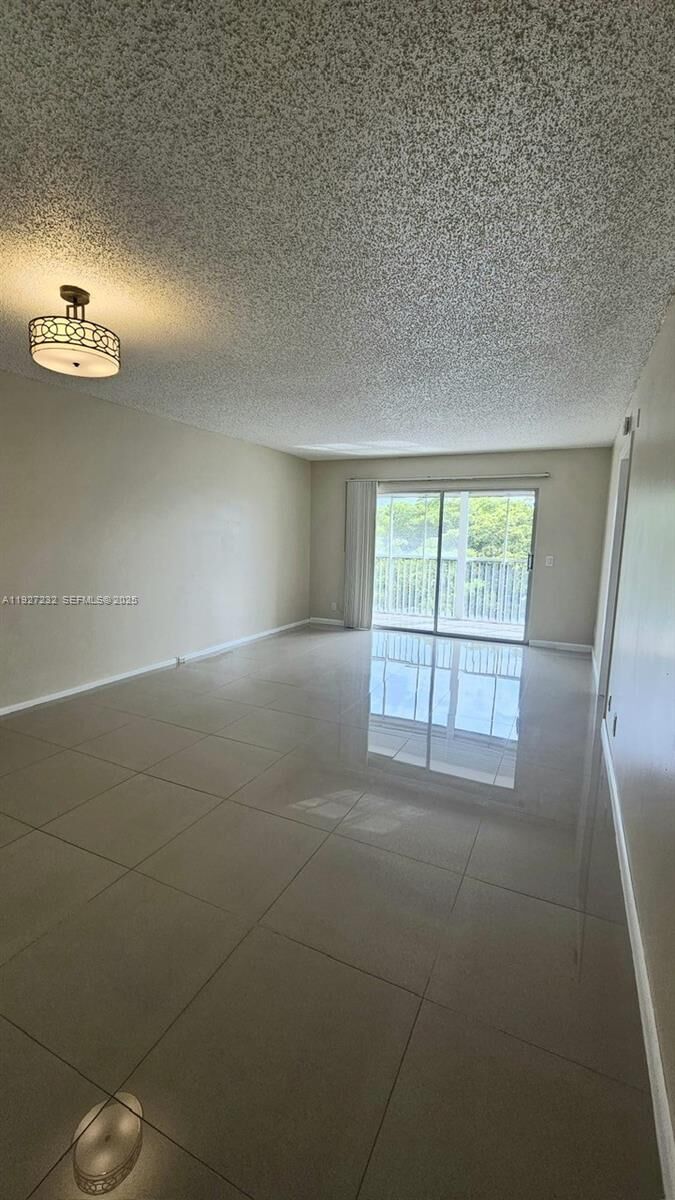 Property Photo:  1401 SW 128th Ter 410H  FL 33027 