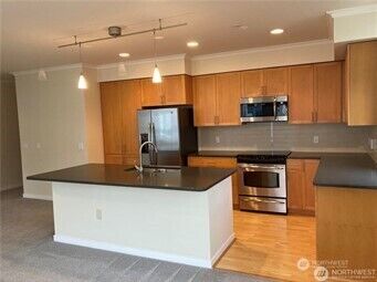 Property Photo:  180  Harbor Square Loop NE B422  WA 98110 
