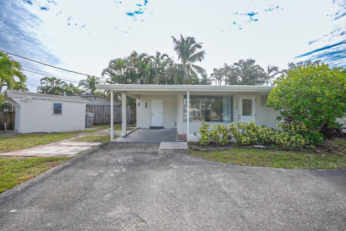 Property Photo:  1100 NE 3rd Street  FL 33060 