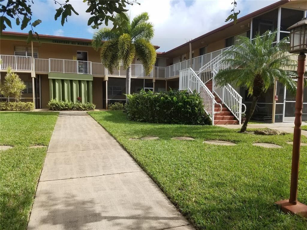 Property Photo:  411 S Crescent Drive 104  FL 33021 