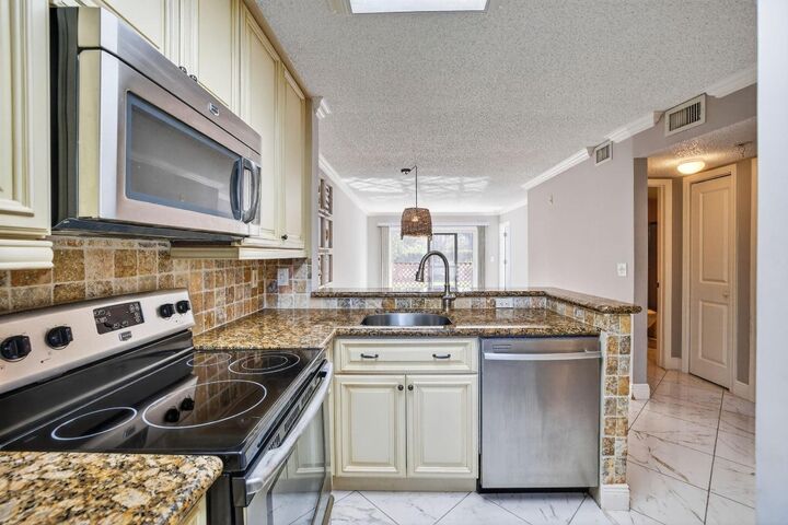 Property Photo:  2230 N Cypress Bend Drive 108  FL 33069 