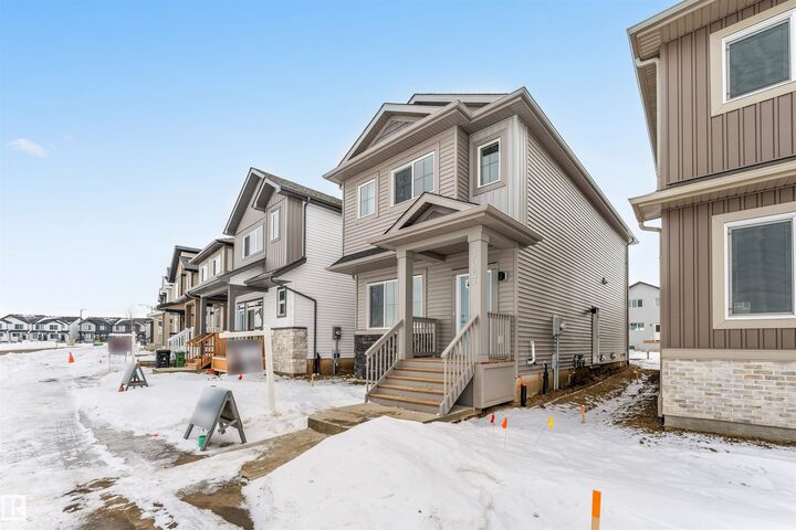 Property Photo: 1027 Aster Boulevard NW AB T6T 2W7