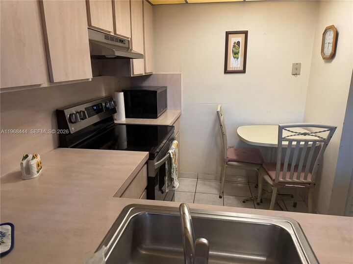 Property Photo:  11750 SW 18th St 313-1  FL 33175 