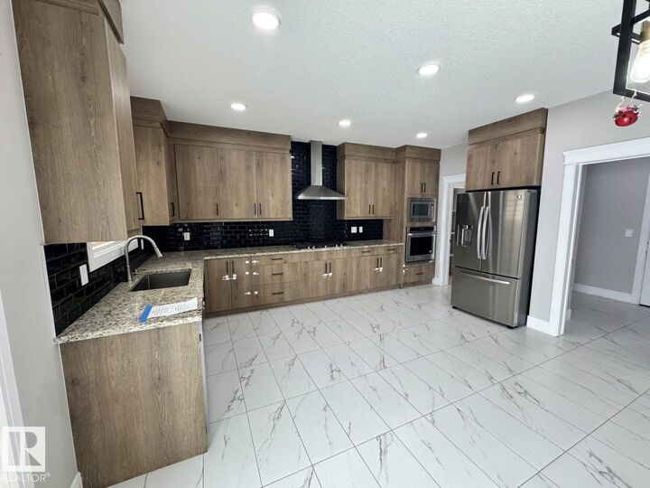 Property Photo: 8729 Mayday Lane SW AB T6X 2L3