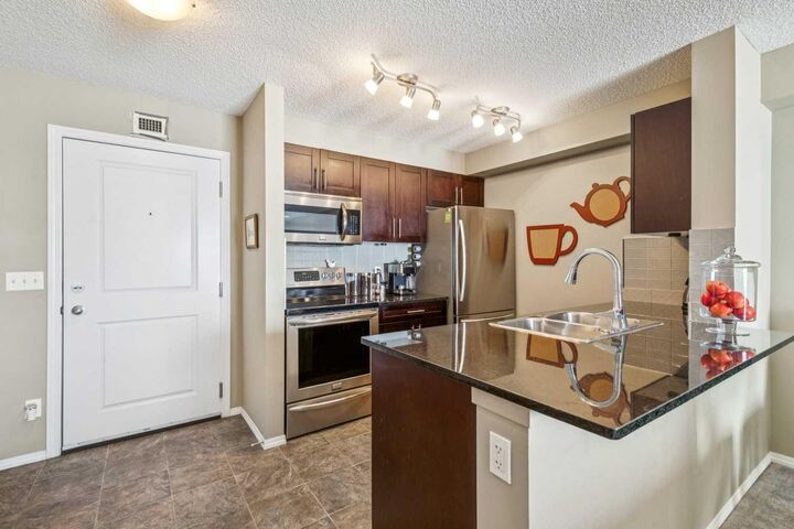Property Photo: 403 Mackenzie Way SW 6409 AB T4B 3V7