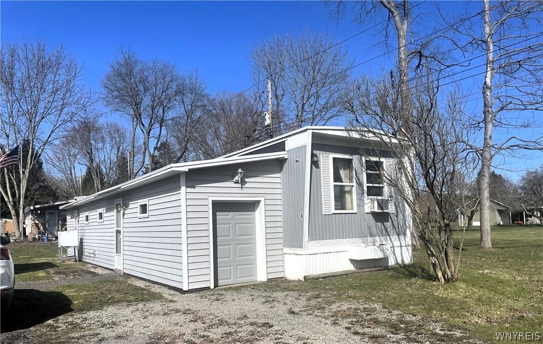 Property Photo:  7207 Hunters Creek #4 Road 4  NY 14080 