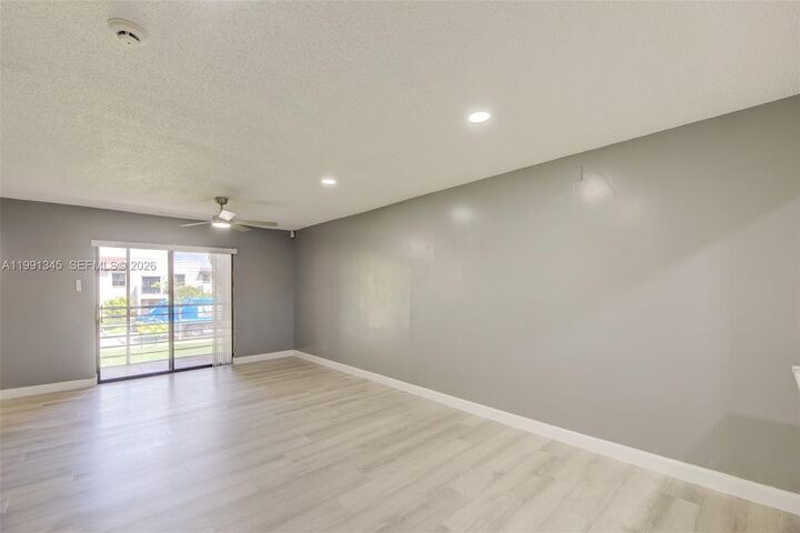 Property Photo:  851 NE 209th Ter 203-23  FL 33179 
