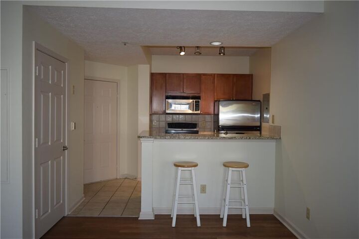 Property Photo:  1250 Parkwood Circle SE 1102  GA 30339 