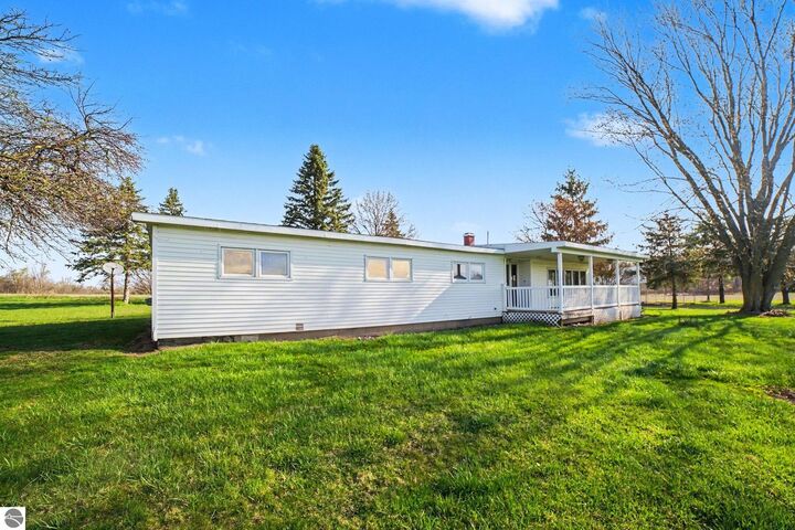 Property Photo:  115 E River Road  MI 48858 