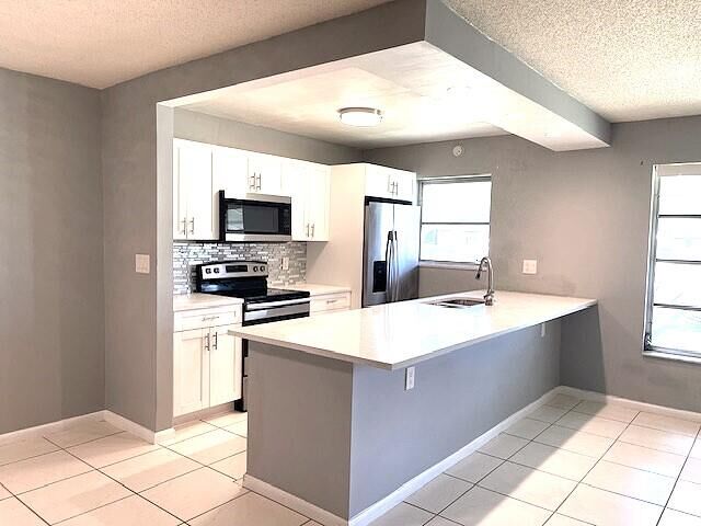 Property Photo:  580 High Point Drive B  FL 33445 