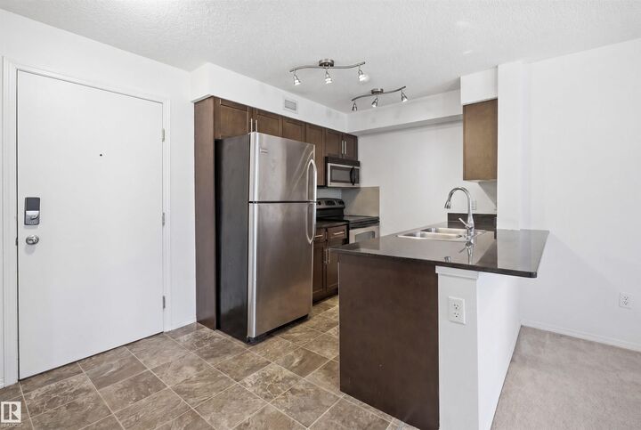 Property Photo:  11812 22 Ave SW 205  AB T6W 2A2 