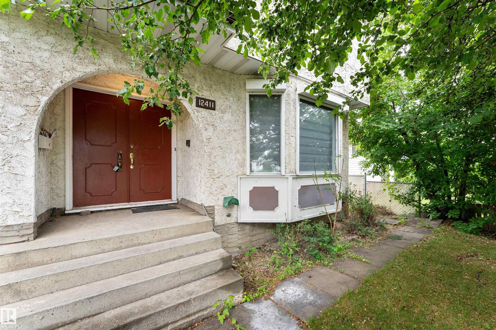 Property Photo:  12411 94 Street NW  AB T5G 1K5 