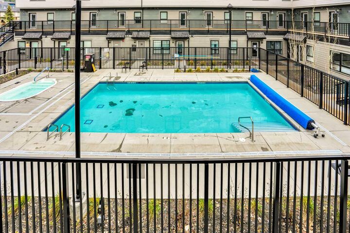 Property Photo:  109 Kanananskis Way 206  AB T1W 2X2 