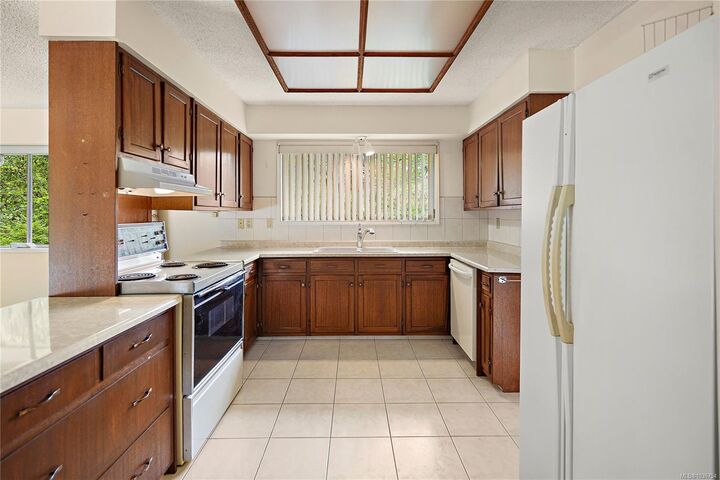 Property Photo:  3976 Tudor Ave  BC V8N 4L6 