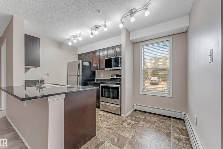 Property Photo:  11803 22 Ave SW 118  AB T6W 2R9 