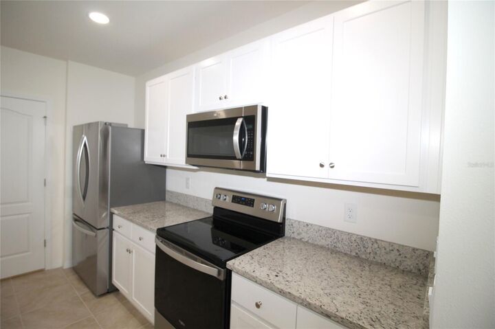 Property Photo:  9488 Black Walnut Drive  FL 34715 
