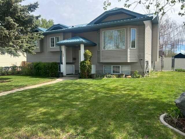 Property Photo:  144 Upland Boulevard W  AB T1R 0R3 