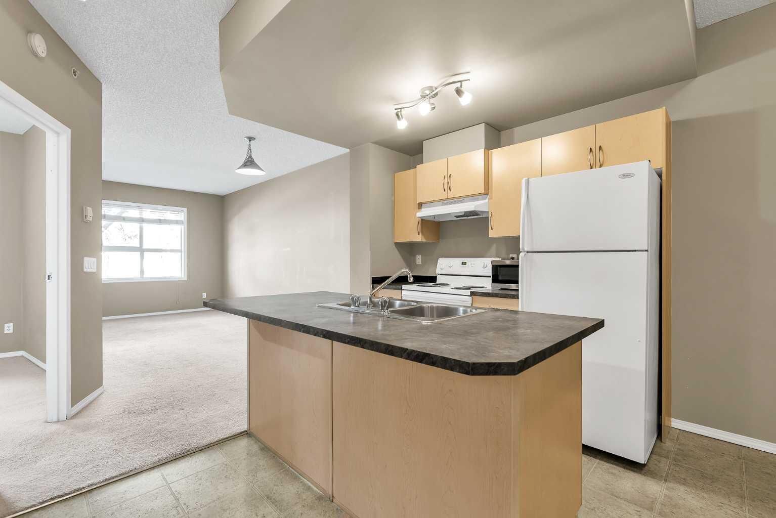 Property Photo: 73 Erin Woods Court SE 1103 AB T2B 3V2