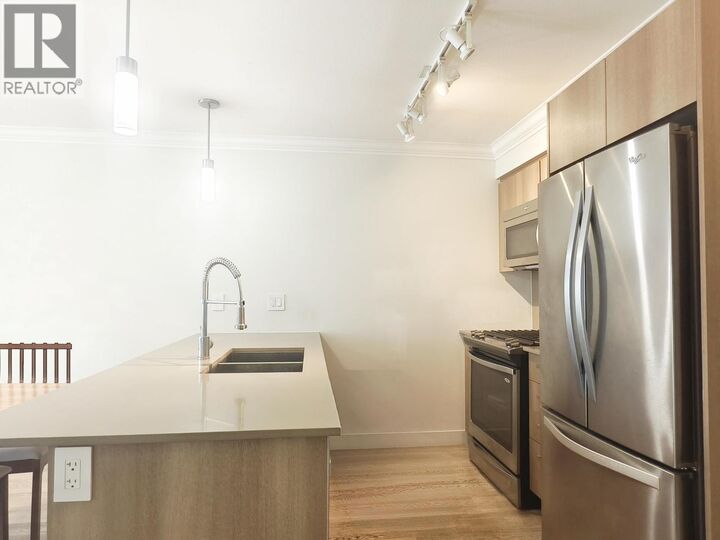 Property Photo:  7058 14th Avenue 209  BC V3N 0E6 