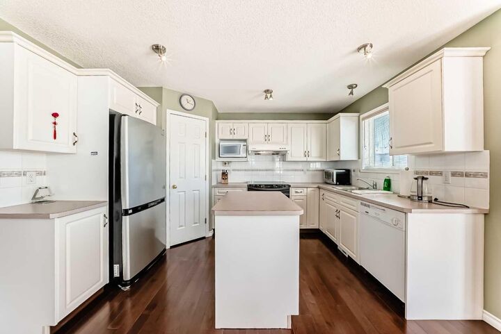 Property Photo: 438 Bridlewood Place SW AB T2Y 3R1