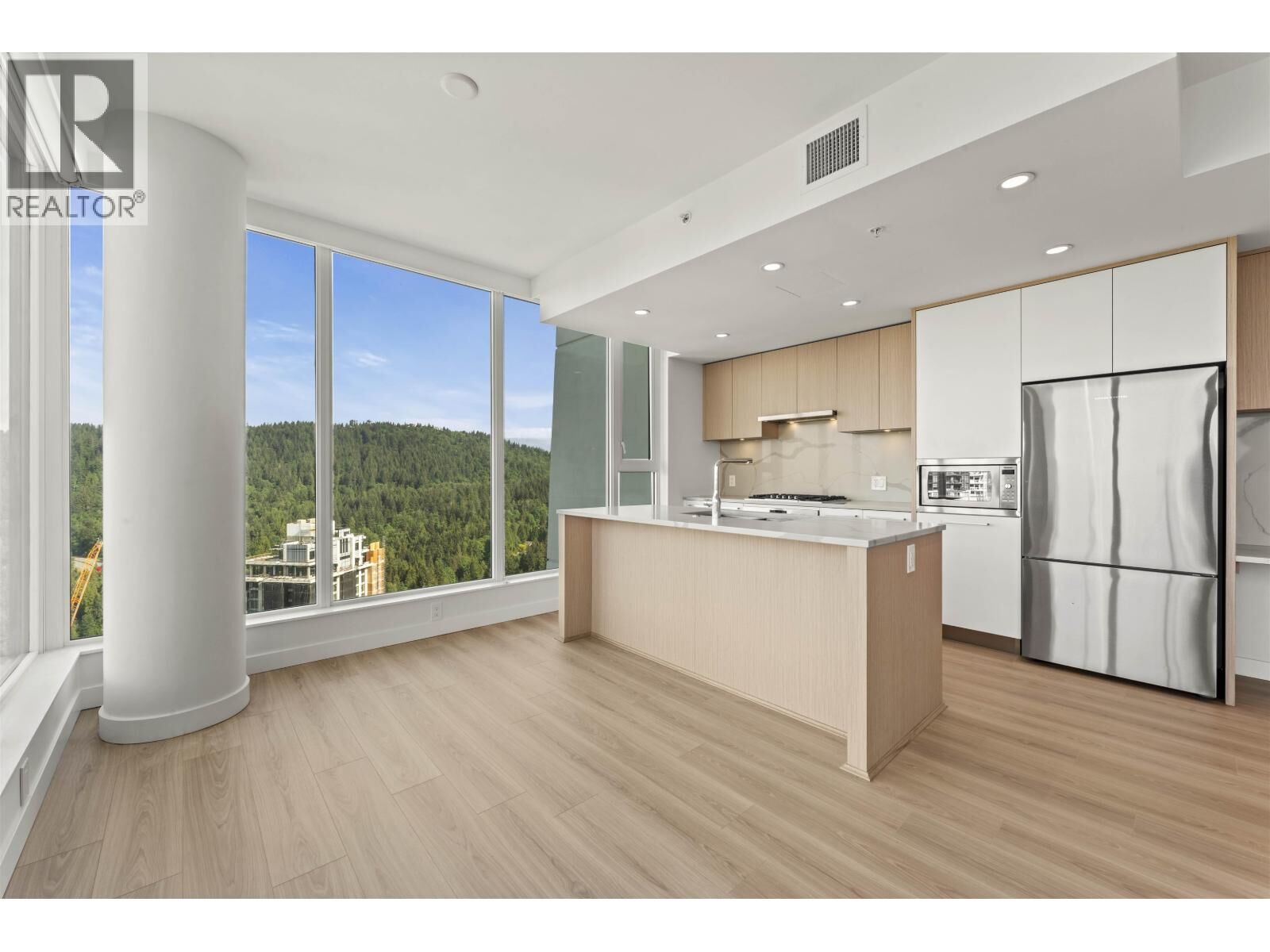 Property Photo: 567 Clarke Road 2901 BC V3J 0K7