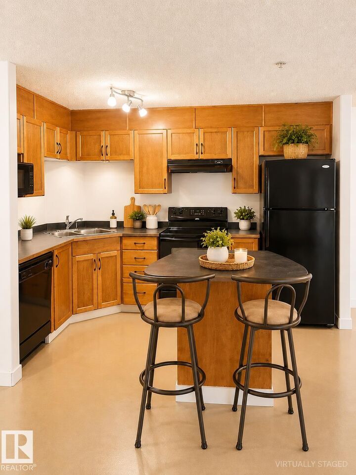 Property Photo: 5340 199 Street NW 115 AB T6M 0A5