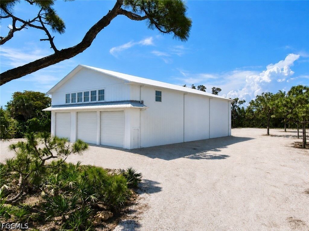 Property Photo:  6690 Pineland Road  FL 33922 