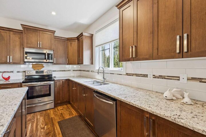 Property Photo: 102 Cooperswood Place SW AB T4B 3T6