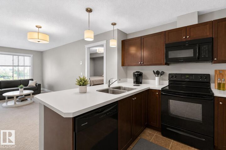 Property Photo: 3715 Whitelaw Lane NW 302 AB T6W 2C3