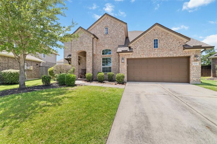 Property Photo: 12043 Tree Top Hills Lane TX 77377