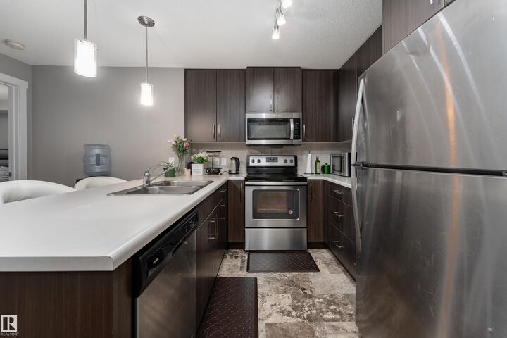 Property Photo:  3670 139 Avenue NW 115  AB T5Y 3N5 