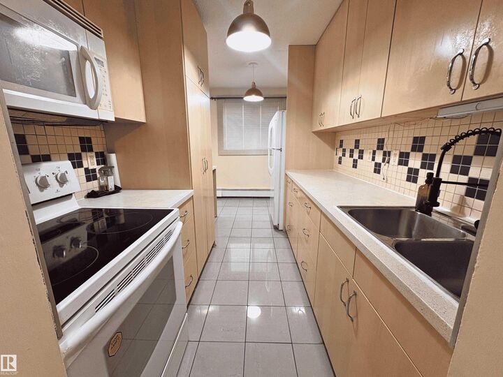 Property Photo: 15105 121 Street NW 109 AB T5X 2G3