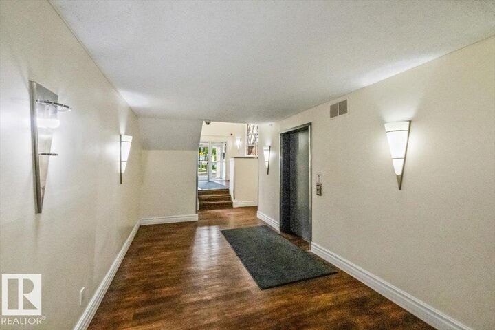 Property Photo:  9010 106 Avenue NW 113  AB T5H 4K3 