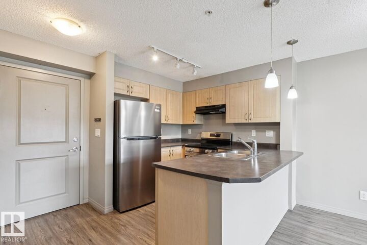 Property Photo: 11453 Ellerslie Road SW 312 AB T6W 1T3