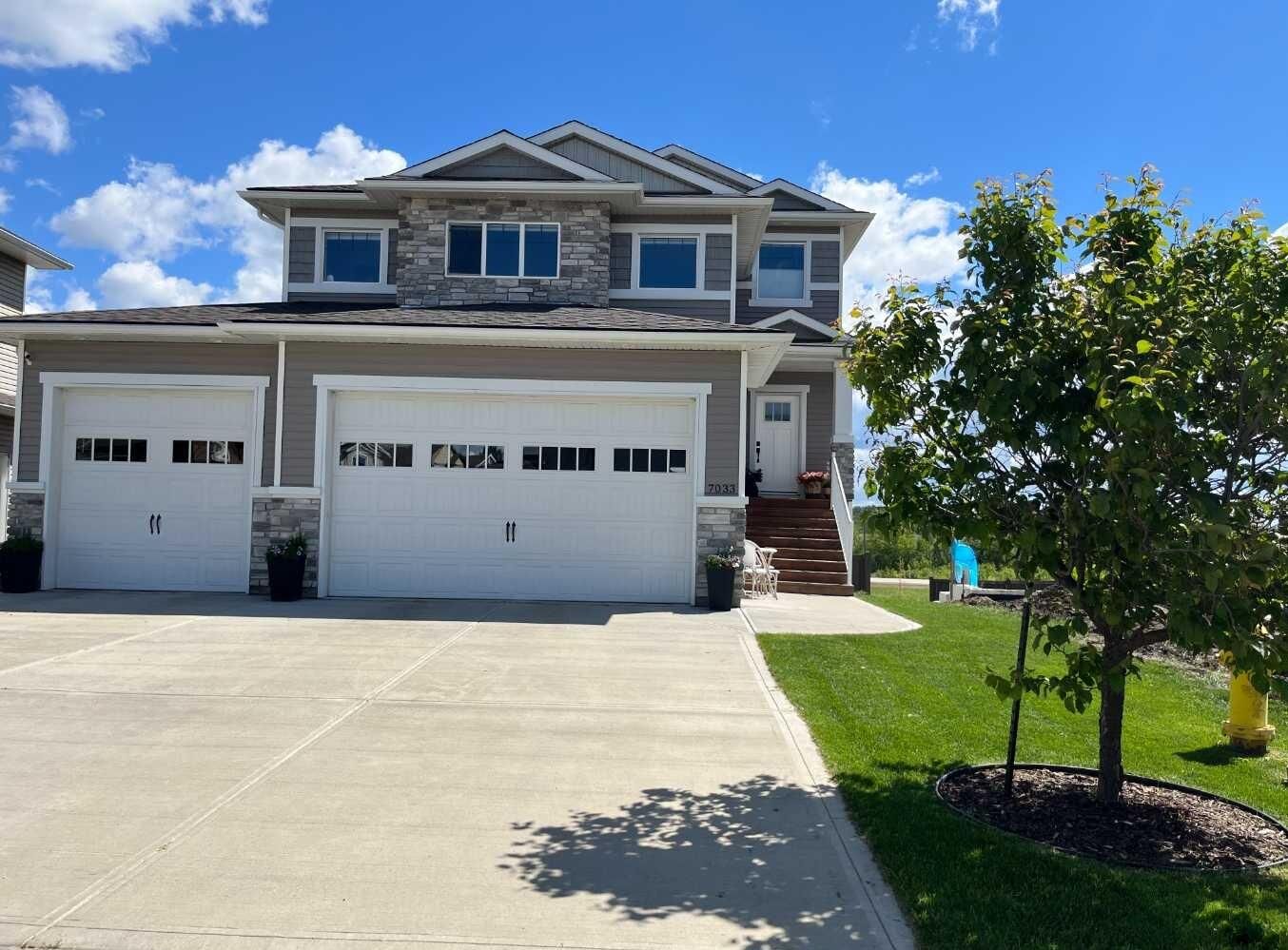 Property Photo: 7033 85 Street AB T8X 0J3